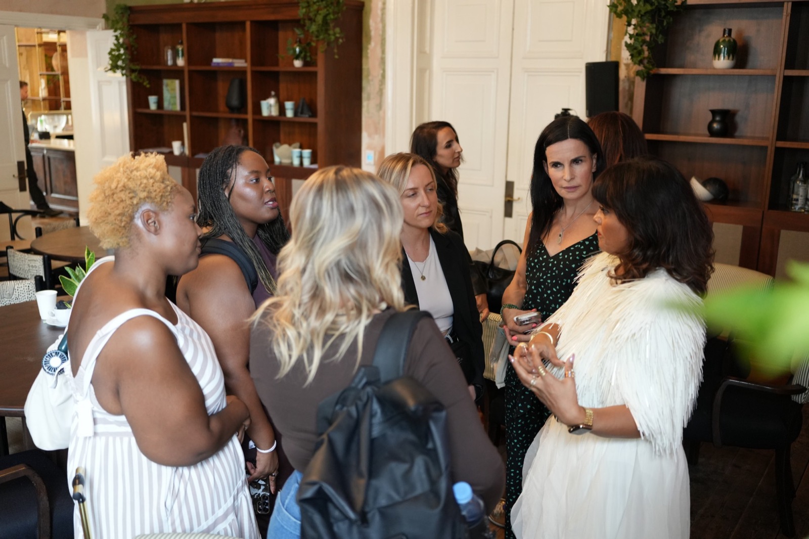 Nishma talking with a group of women at a Switched ON session